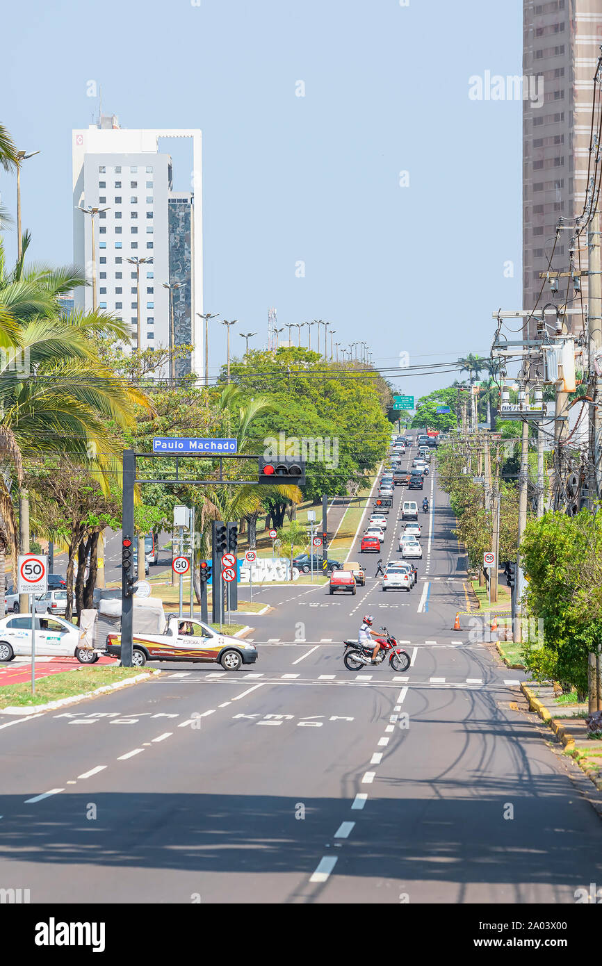 Campo Grande - MS, Brazil - September 13, 2019: Traffic at the Afonso Pena avenue, the main avenue of the city. Tree-lined large avenue. Stock Photo