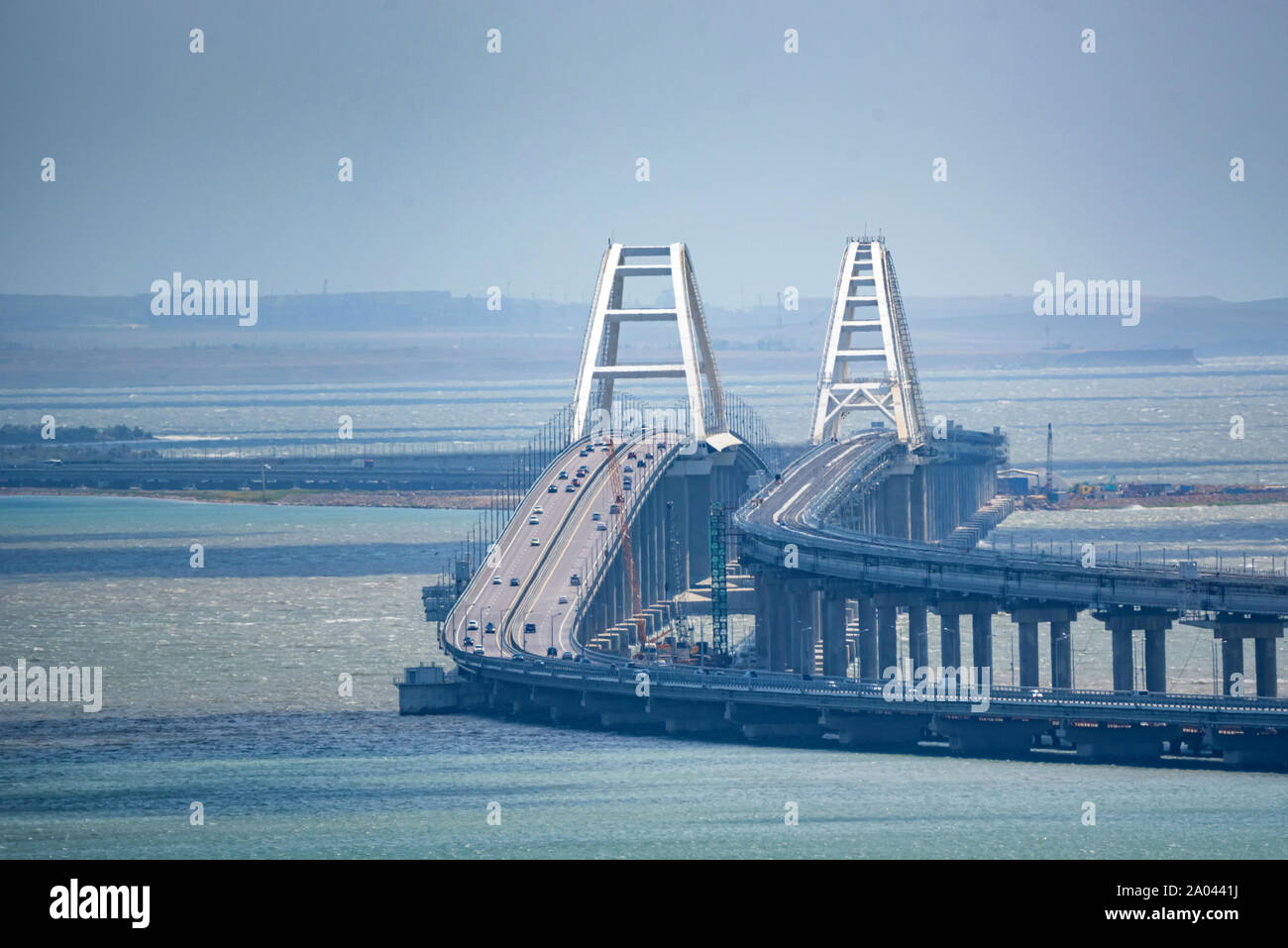 Distant view Crimean automobile bridge connecting the banks of the Kerch Strait: Taman and Kerch. Sunny summer day Stock Photo