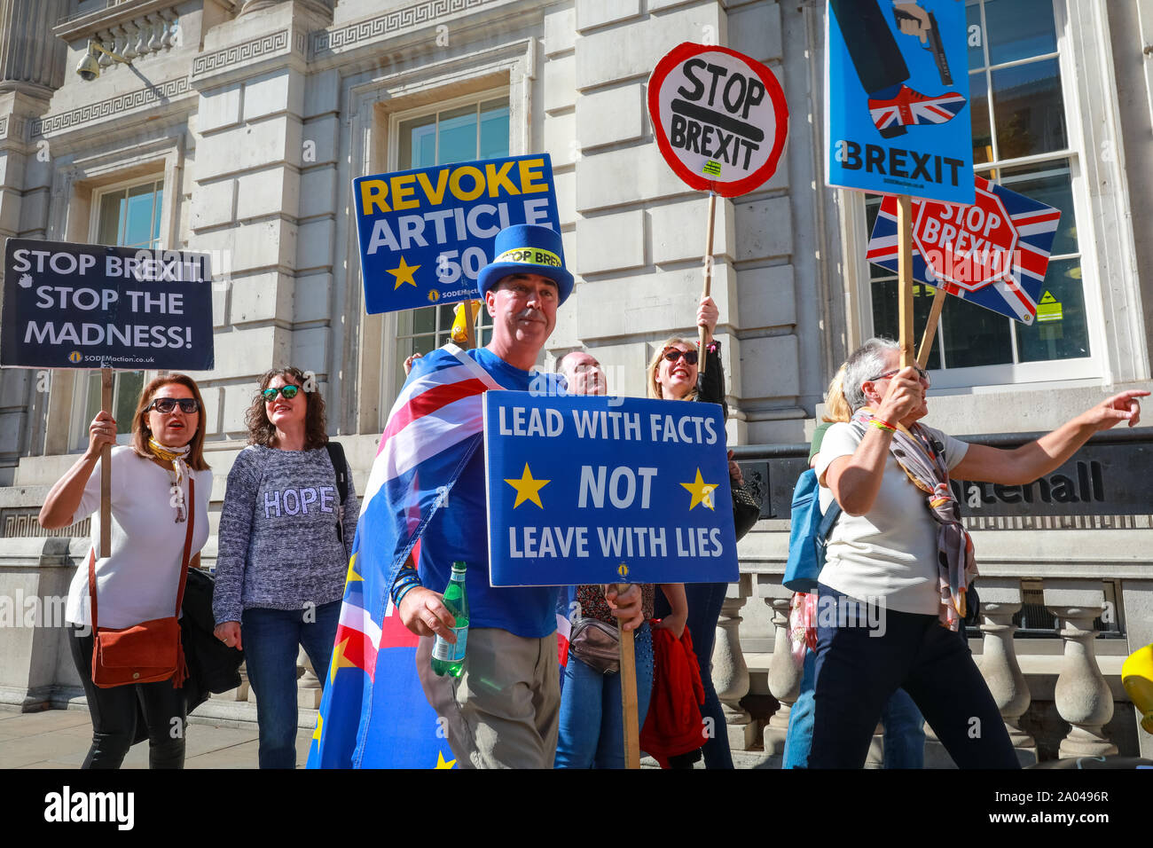 Westminster, London, UK, 19th Sep 2019. A group of Spanish visitors grab placards and spontaneously join in the 'Stop Brexit' chants. Anti-Brexit protesters, including 'Stop Brexit Man' Steven Bray, rally outside the Cabinet Office in Westminster. Credit: Imageplotter/Alamy Live News Stock Photo