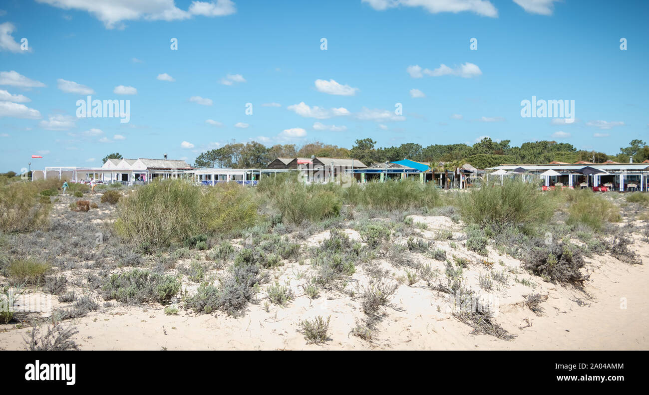 Tavira Island, Portugal - May 3, 2018: Tourist restaurant terrace on the island of Tavira in the beach town center on a spring day Stock Photo