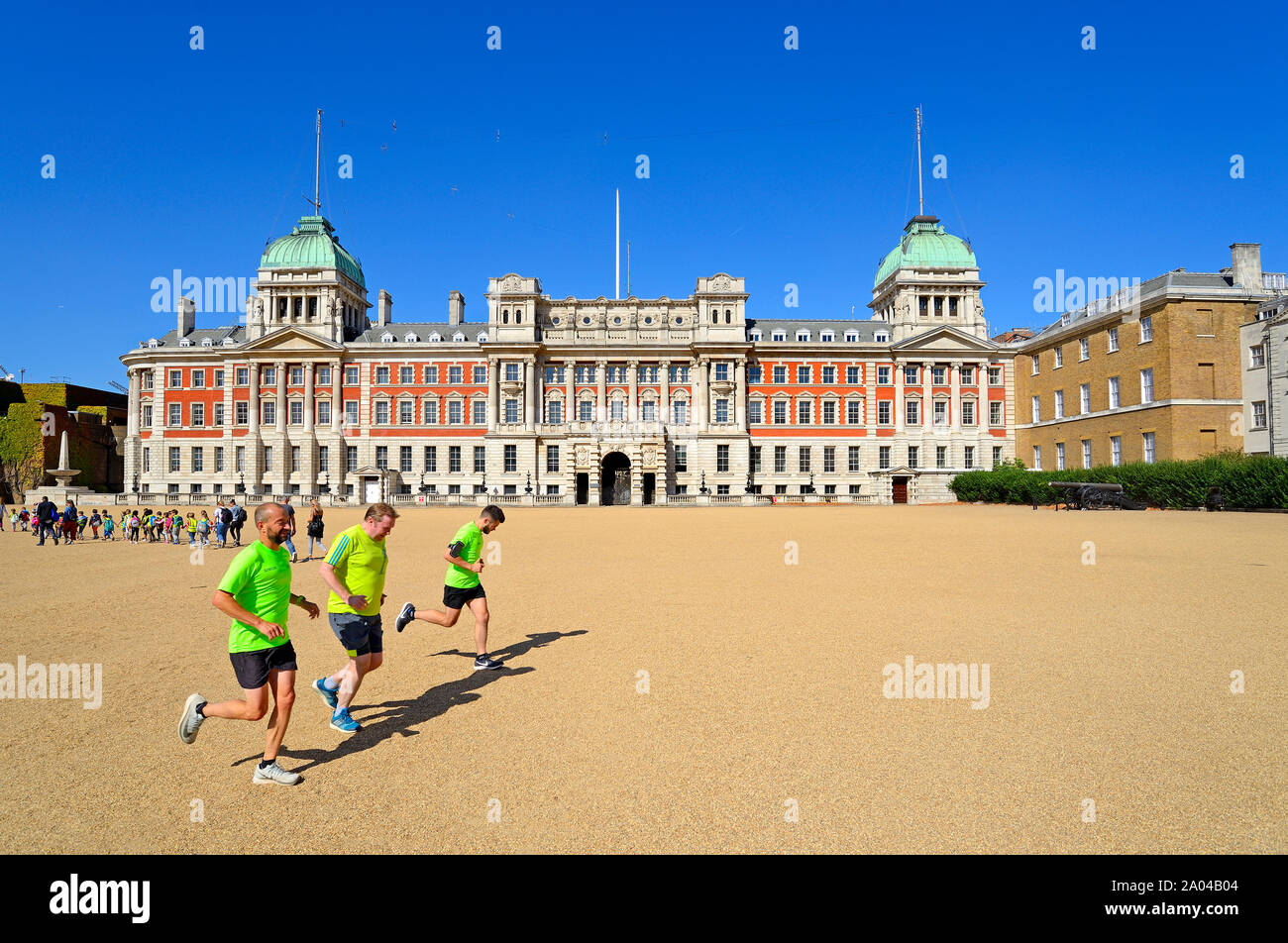 London, England UK. Horse Guards Parade and the Old Admiralty Building. Three men jogging Stock Photo