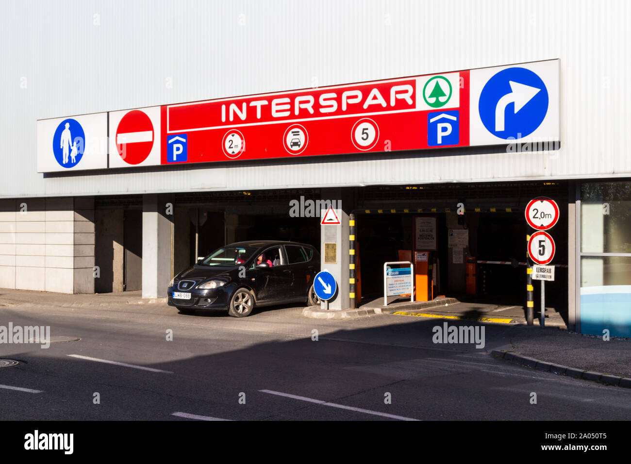 Car park entrance under Interspar hypermarket building Stock Photo