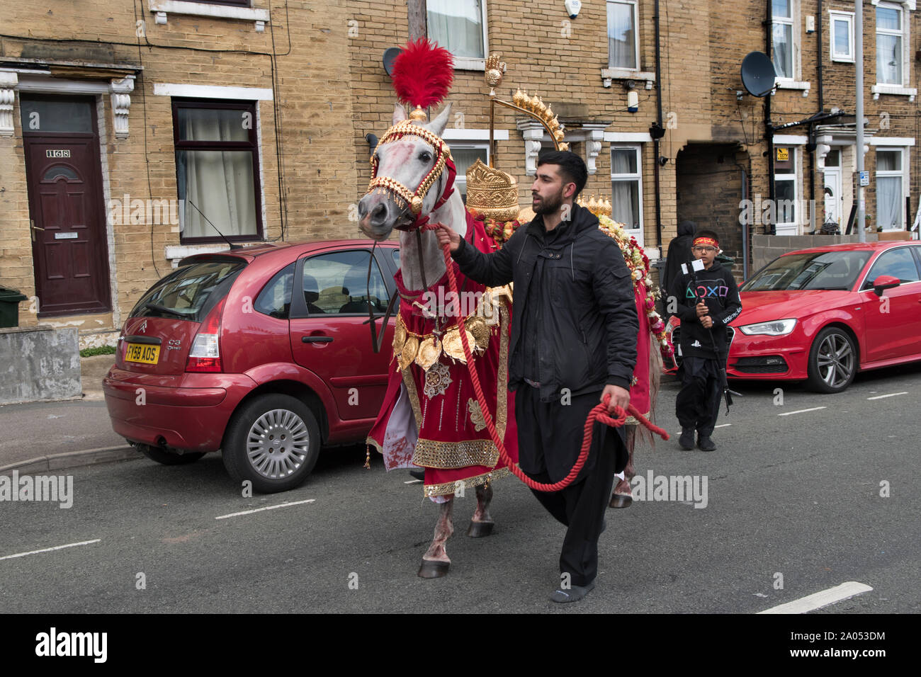 Muslim community Bradford 2019 2010s UK. Day of Ashura parade Shia Muslims  remember the martyrdom of Hussain. The horse represents the one that Husayn ibn Ali rode into  Battle of Karbala HOMER SYKES Stock Photo