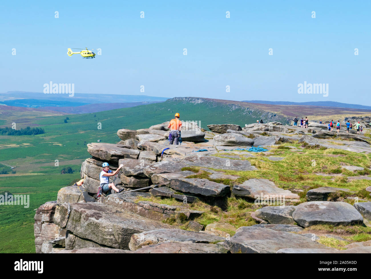 Air ambulance helicopter in rescue drill practice drill Stanage edge Peak district National park Derbyshire England UK GB Europe Stock Photo