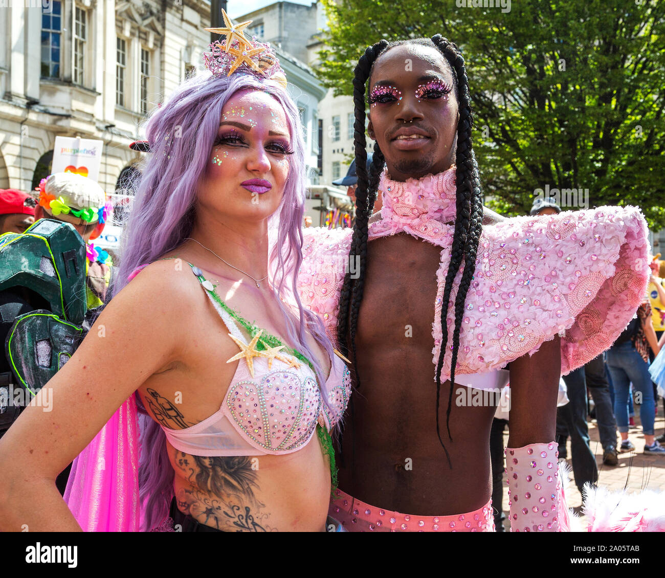 Birmingham Pride 2019. Revellers wearing wonderful costumes and makeup wait for the parade to begin. Stock Photo