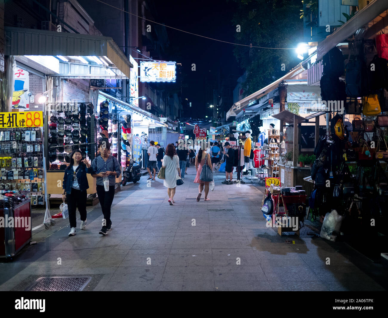 Kaohsiung, Taiwan: Pedestrian Area at Shinkuchan Shopping District 新堀江商圈. Small shops and stores along the street market at night Stock Photo