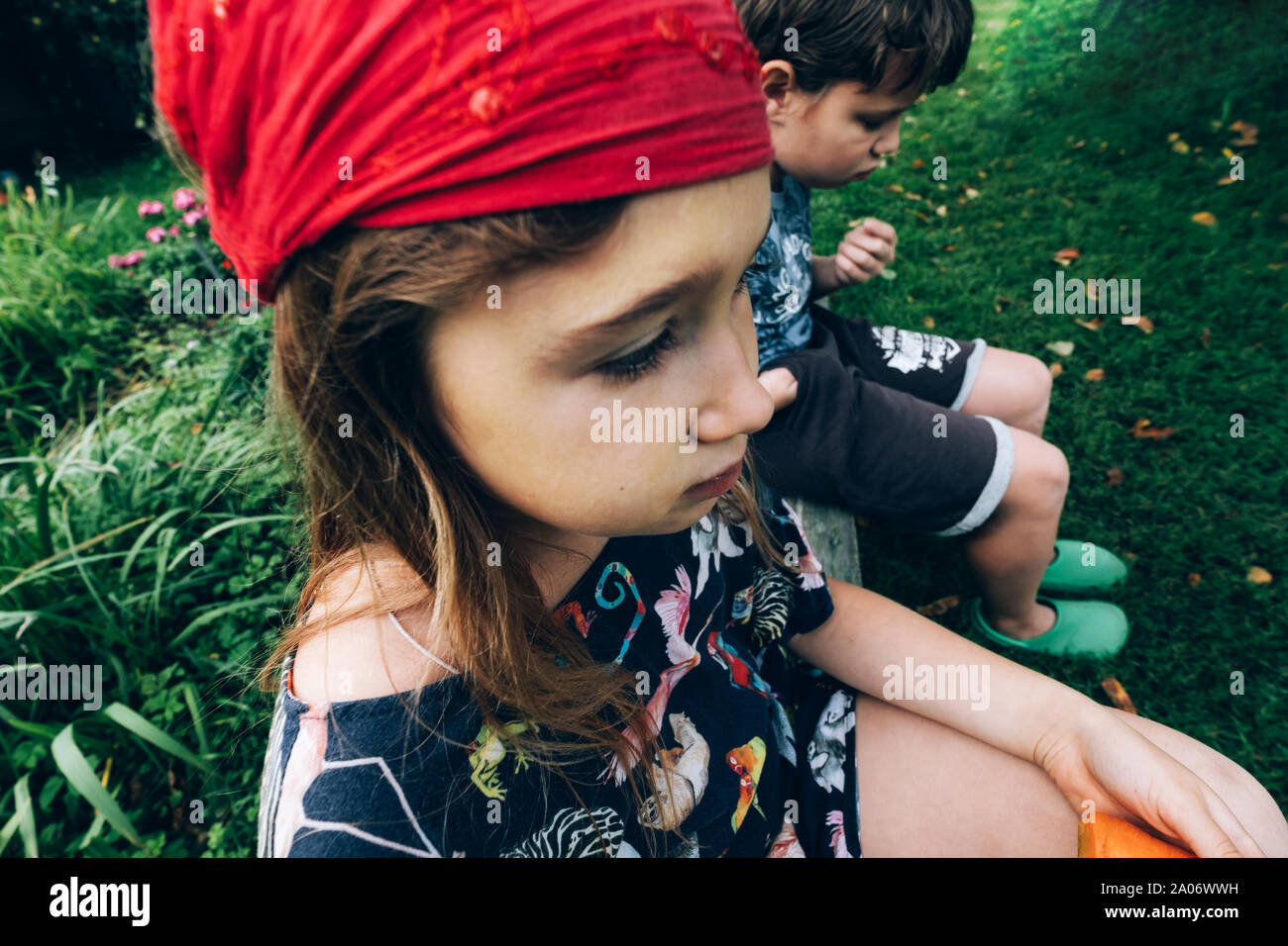 Sad Little Kids Sitting On Bench Close Up Disappointed Girl And