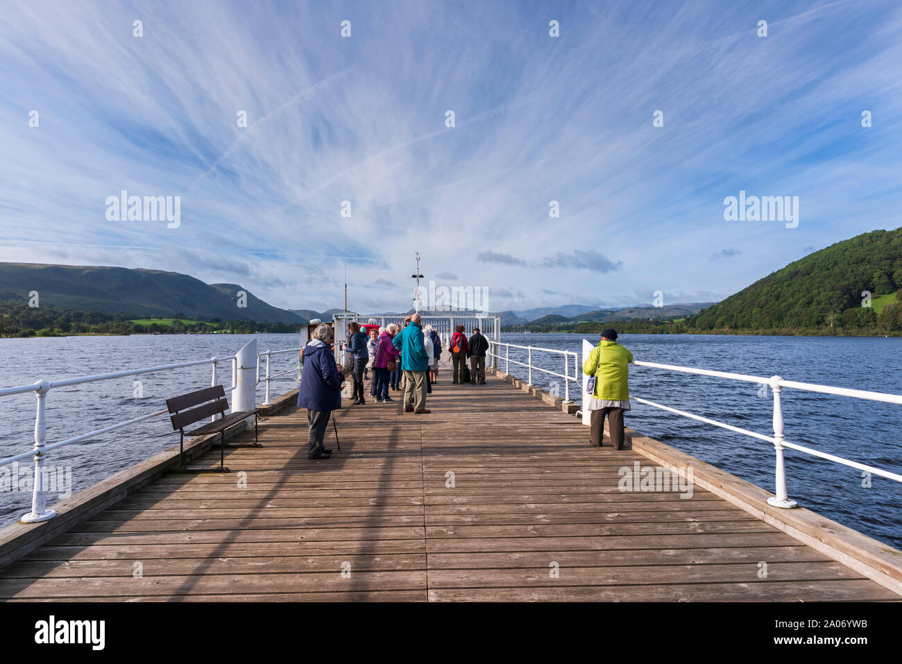 Passengers waiting for the Ullswater Steamer on the jetty at Pooley Bridge in the English Lake District, Cumbria Stock Photo