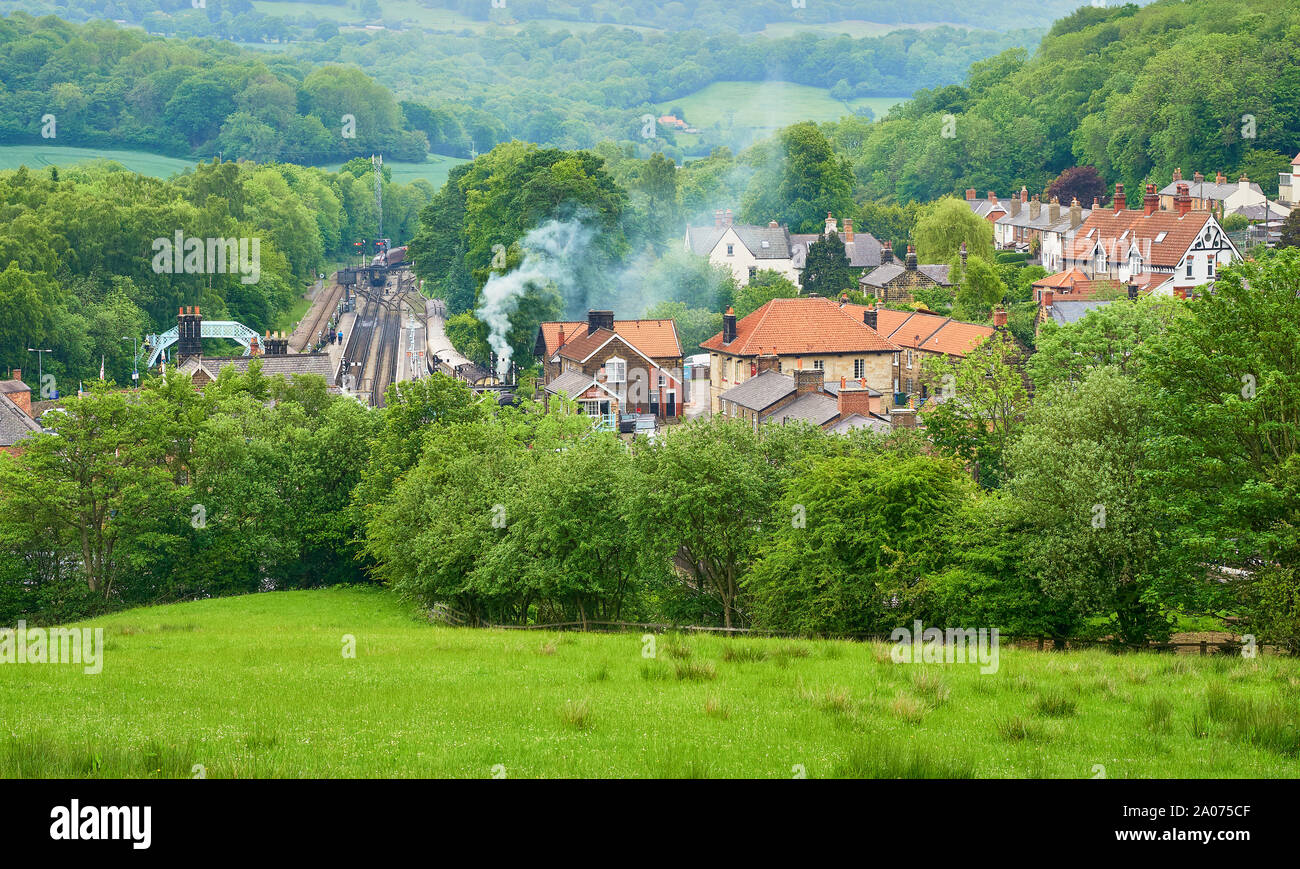 A view looking down over the landscape surrounding the Village of Grosmont and the North York Moors Railway station in the spring Stock Photo