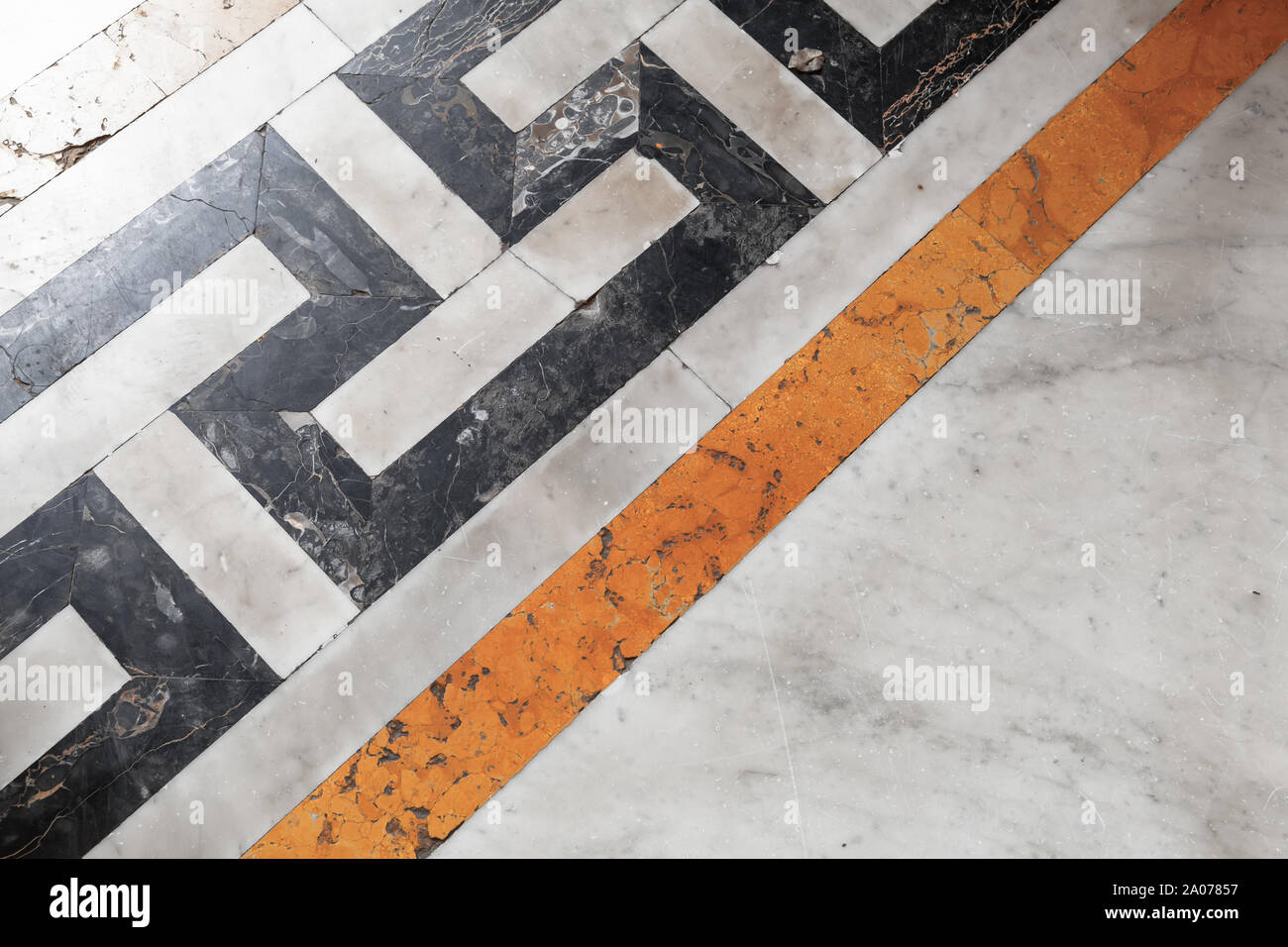 Retro stone mosaic floor tiling with yellow black and white geometric ...