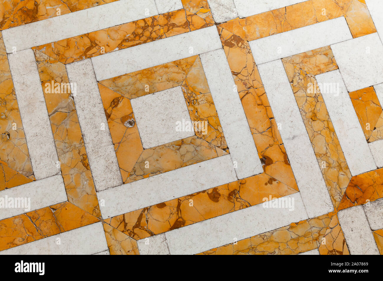Retro style stone mosaic floor tiling with yellow white geometric ...