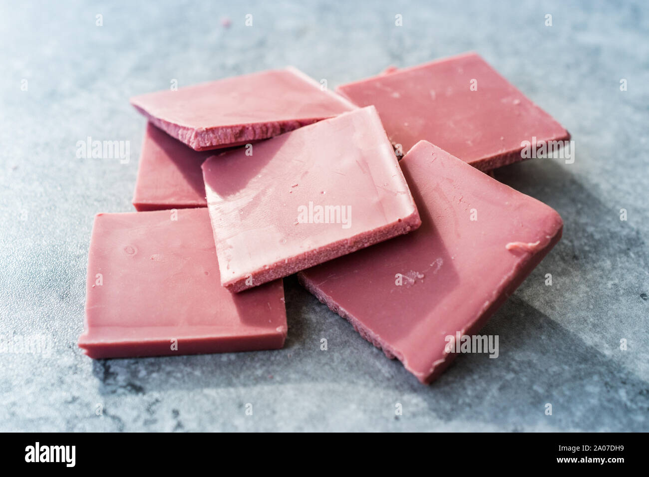 Ruby Chocolate Pieces. New Type of Processing Cocoa Beans.  Sweet Snacks. Stock Photo