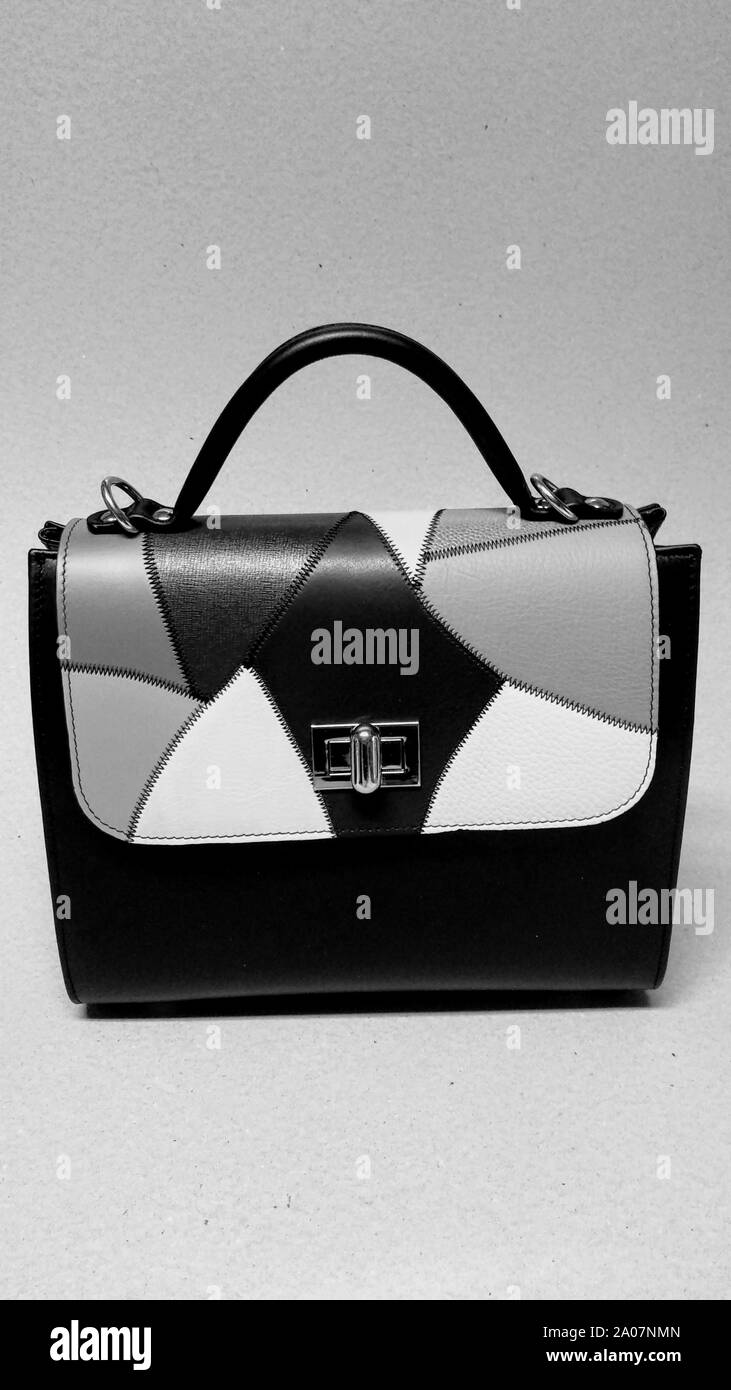 Small black leather hand bag with black and white mosaic flap Stock Photo Alamy