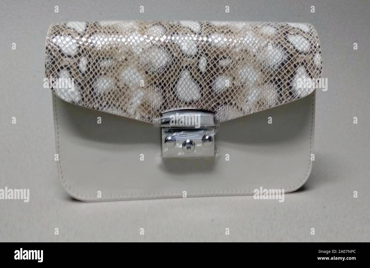 Buy Silver Floral Paatr Purse by Riti Online at Aza Fashions.