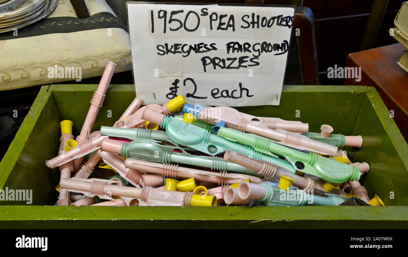 1950s pea shooters. Skegness Fairground prizes. Knicks Knacks Antiques and Curiosities shop at Sutton on Sea, Lincolnshire, UK Stock Photo
