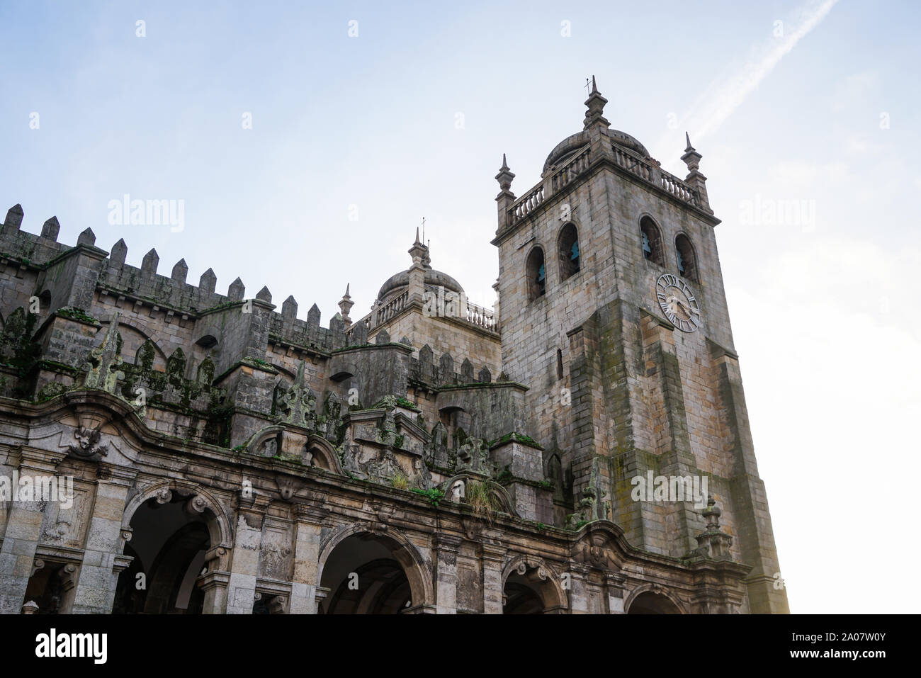 Low-angle shot of the tower of the Porto Cathedral on a bright day. Stock Photo