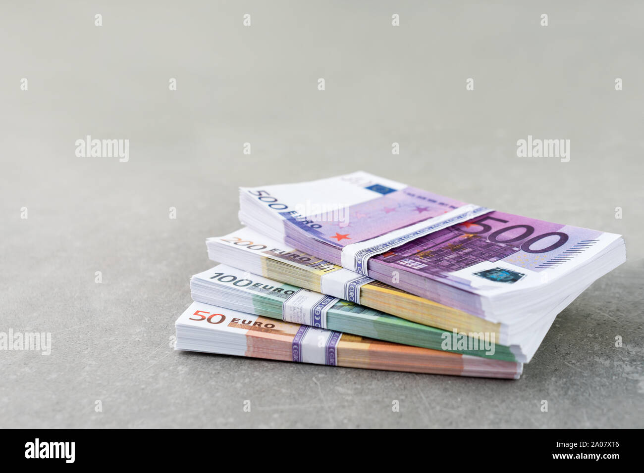 Euro currency money. Cash money, euro bills. Stacks of Euro notes on concrete background in five hundred, two hundreds, one hundreds and fifties Stock Photo