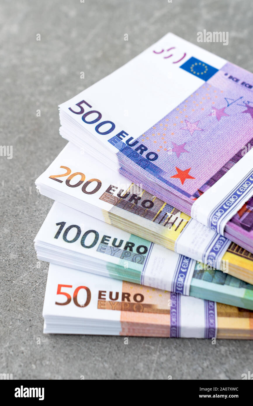 Euro currency money. Cash money, euro bills. Stacks of Euro notes on concrete background in five hundred, two hundreds, one hundreds and fifties Stock Photo