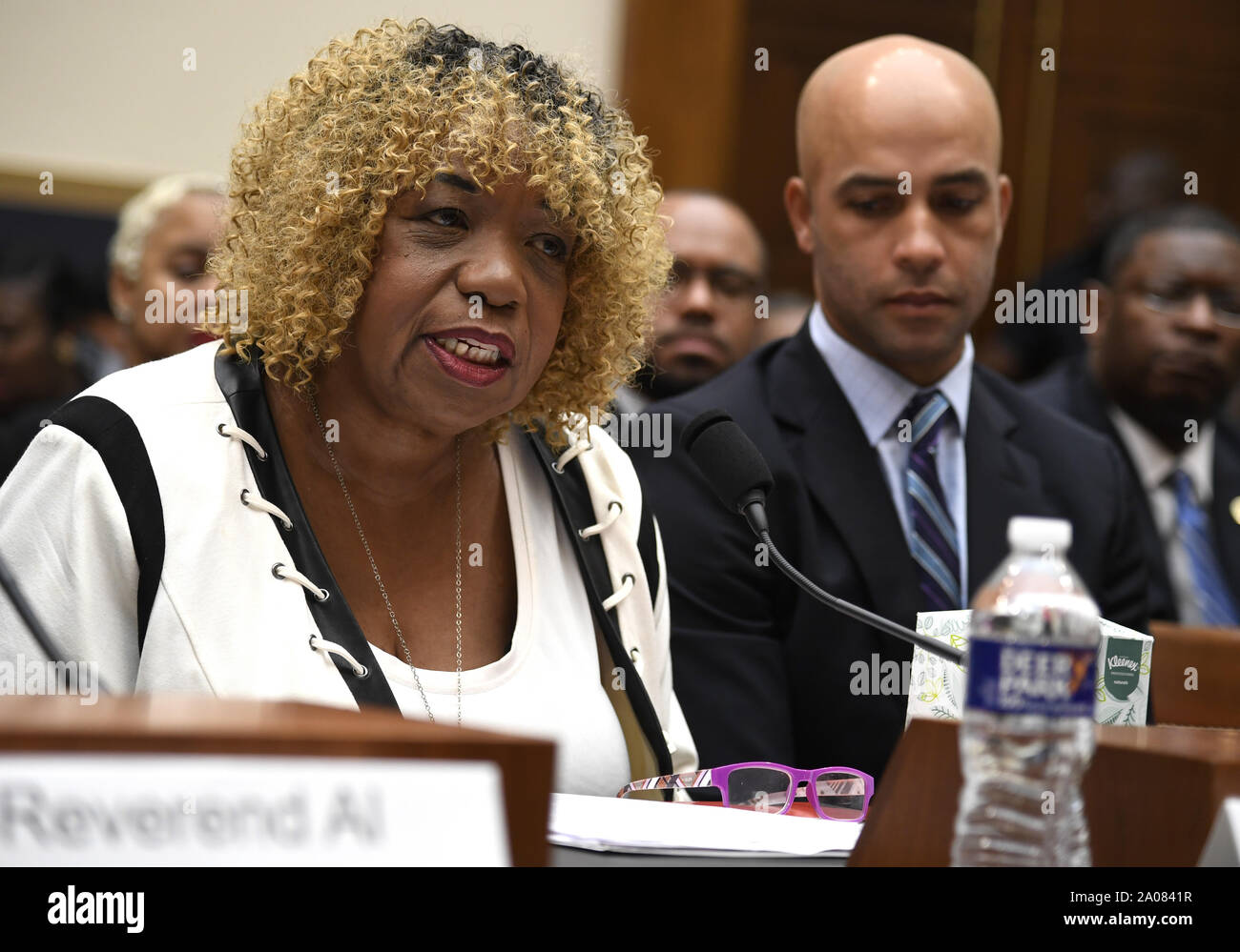 Washington, United States. 19th Sep, 2019. Gwen Carr (L) makes an opening statement as former tennis player James Blake listens at the House Judiciary Committee, on Capitol Hill, Thursday, September 19, 2019, in Washington, DC. The panel was hearing testimony on police practices and Carr's son Eric Garner died in a police chokehold during an arrest on Staten Island, New York and Blake was roughed up in a mistaken arrest in New York City. Photo by Mike Theiler/ Credit: UPI/Alamy Live News Stock Photo