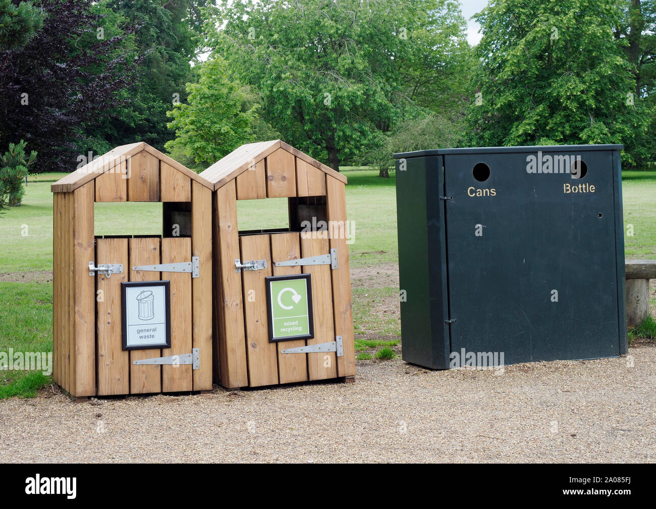 Wooden and metal recycling bins at tourist venue in Norfolk cater for cans, bottles, general