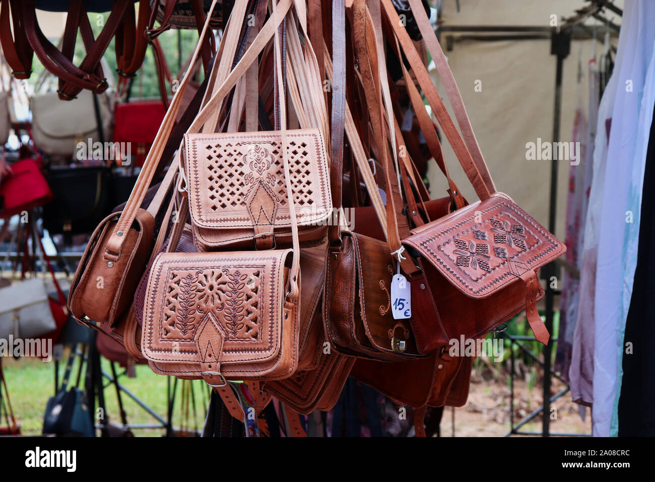 Leather handbags on a market stall in Menorca Stock Photo