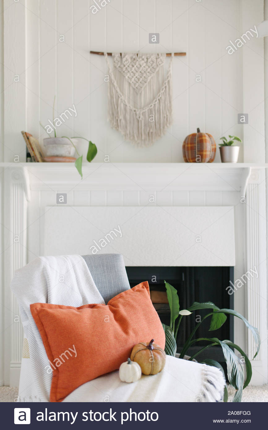 Grey Chair With Striped Throw Orange Accent Pillow And