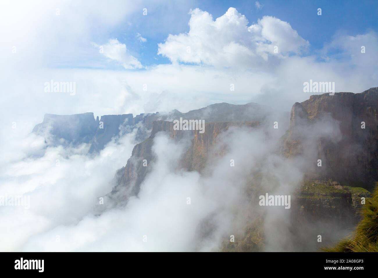 Mists rising up the Amphitheatre in the Drakensberg, South Africa Stock Photo
