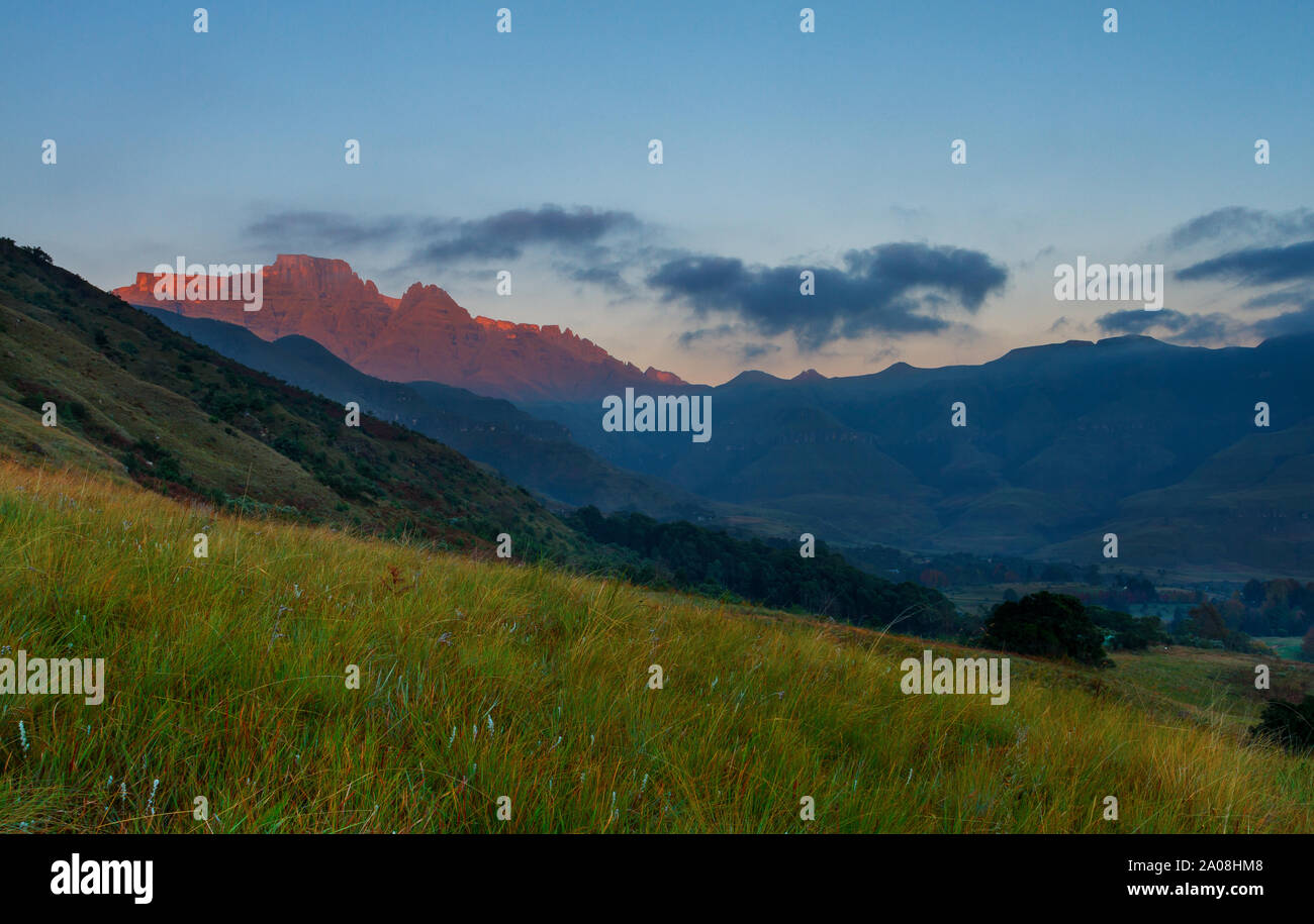 Early morning light hits Cathkin Peak and Champagne Castle from the Cathkin Valley Stock Photo