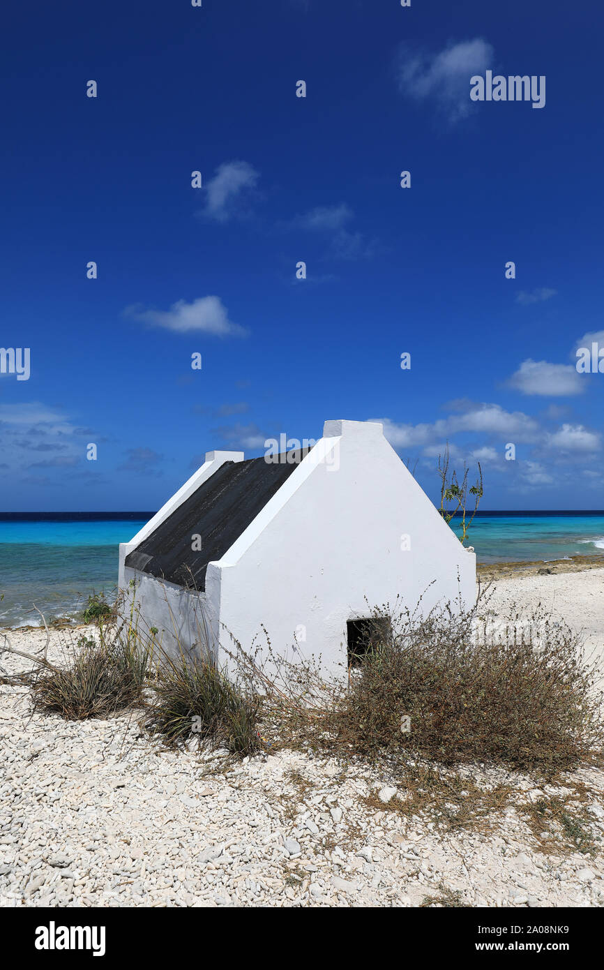 Small white slave hut on Bonaire island in the caribbean sea Stock
