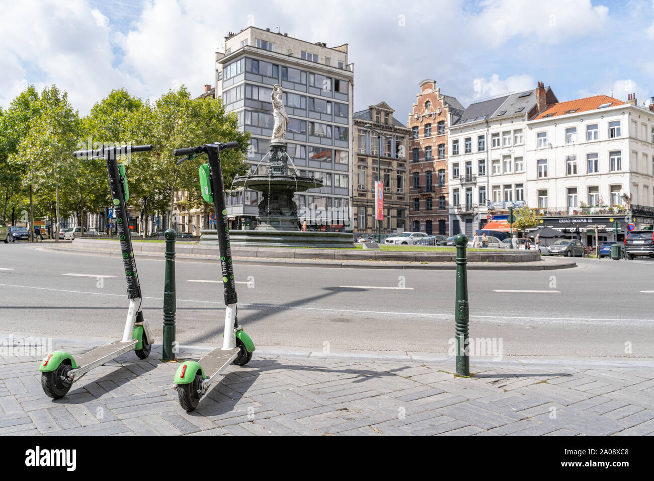 Rental electric scooters on a Place Rouppe square in Brussels, Belgium.  View on Fontein van het Rouppeplein, La Font Stock Photo - Alamy