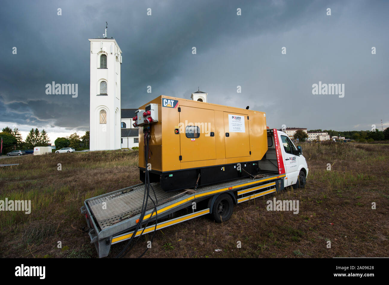 Emergency electric power generator used during stormy weather in Pultusk, Poland, to provide electricity for a community with church and a hospital. Stock Photo
