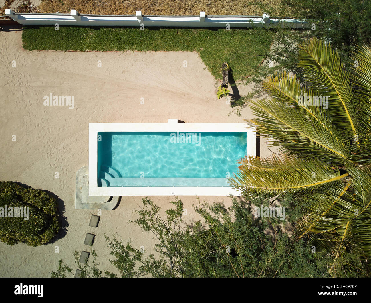 Swimming pool in villa above top view on tropical area Stock Photo - Alamy