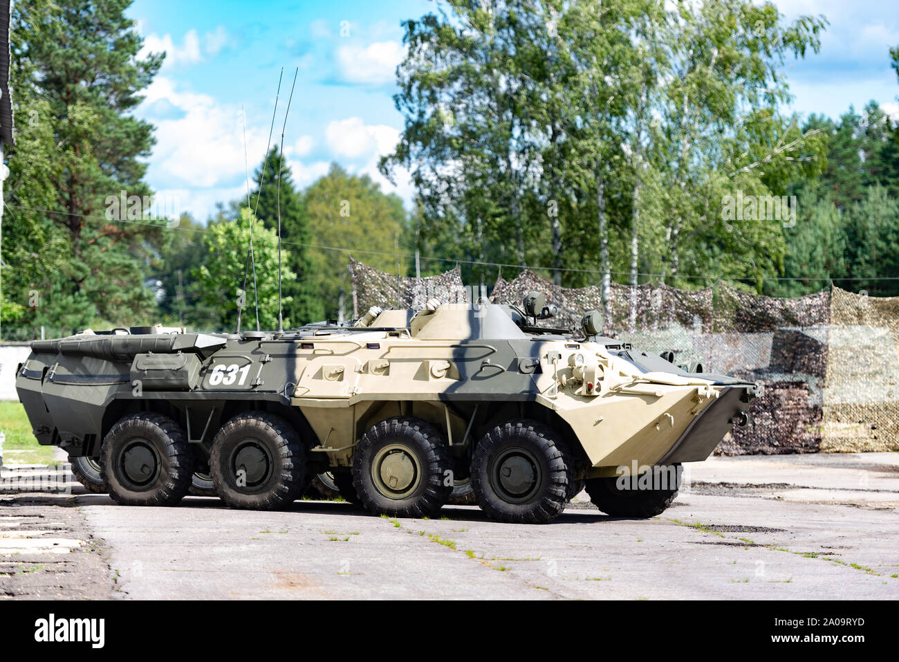 Armored personnel carrier in a military town. Armored vehicle intelligence. Stock Photo