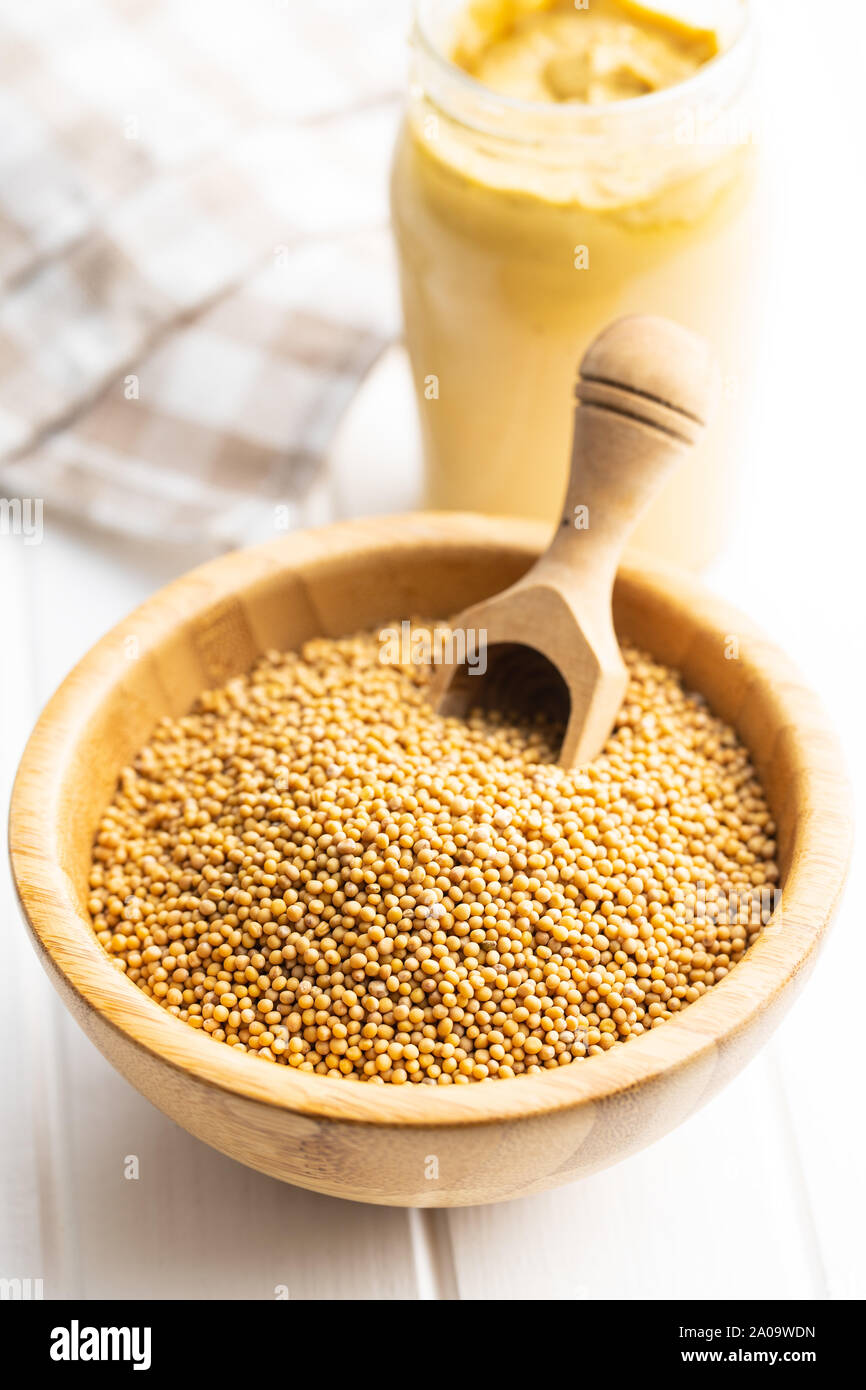 Download Yellow Mustard Seeds In Wooden Bowl With Wooden Scoop On White Table Stock Photo Alamy Yellowimages Mockups