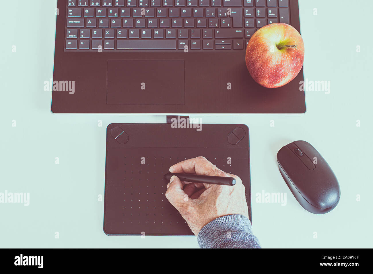 tablet drawing in workspace with laptop top view Stock Photo
