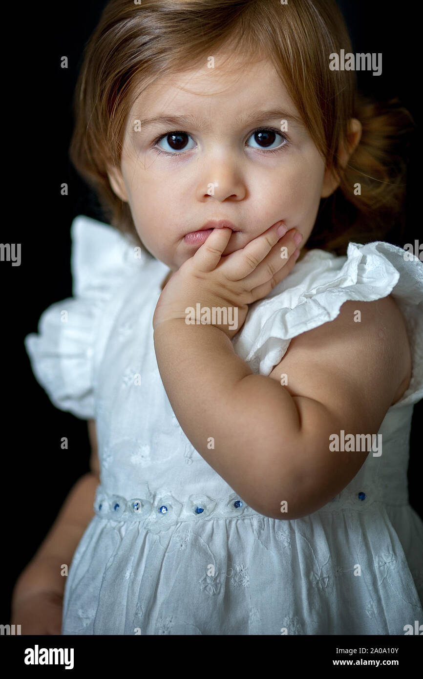 Baby girl in white dress Stock Photo - Alamy