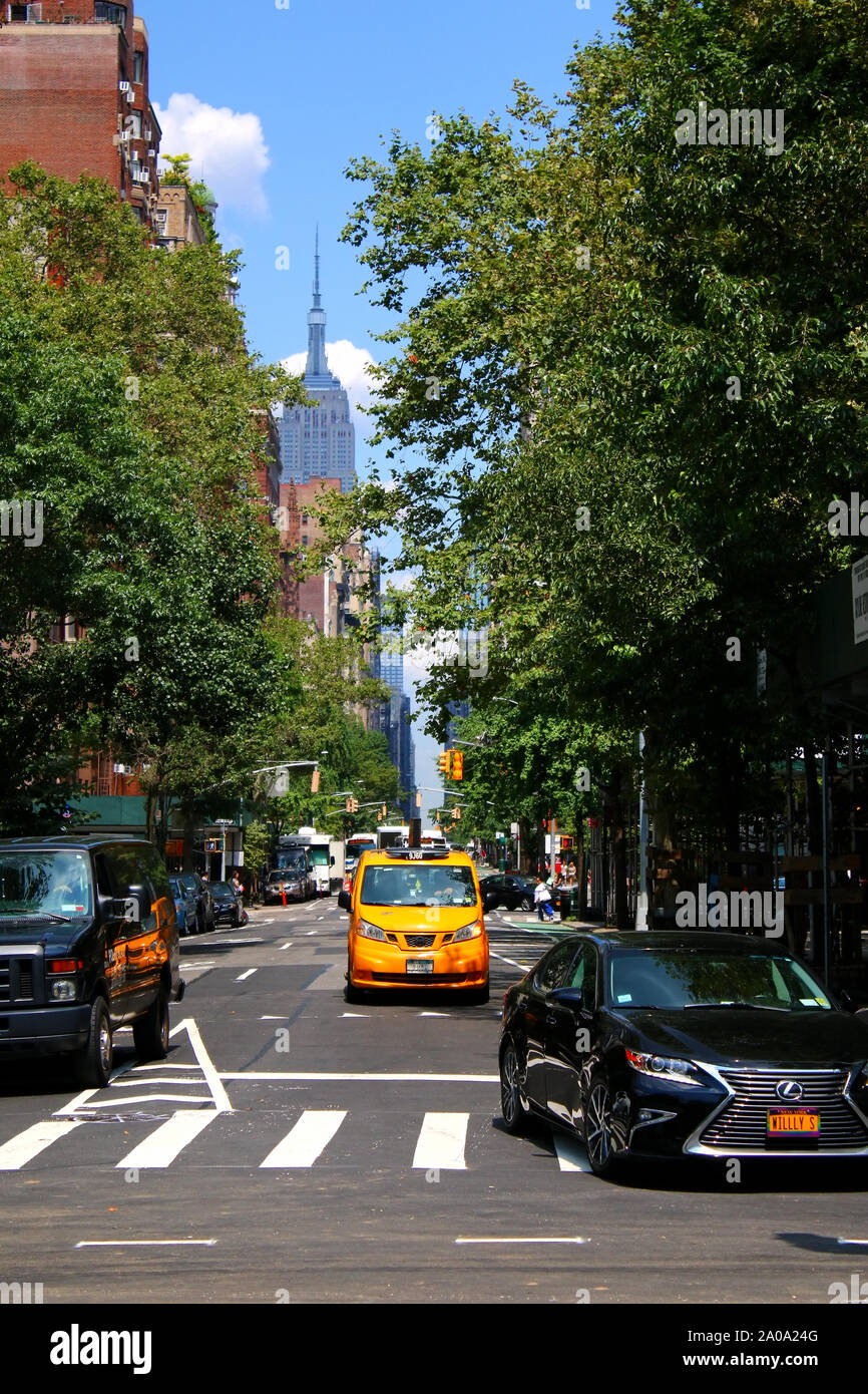 North view of 5th Avenue from where it begins at Washington Square Park with Empire State Building in the distance, in Manhattan on JULY 26th, 2019 in Stock Photo