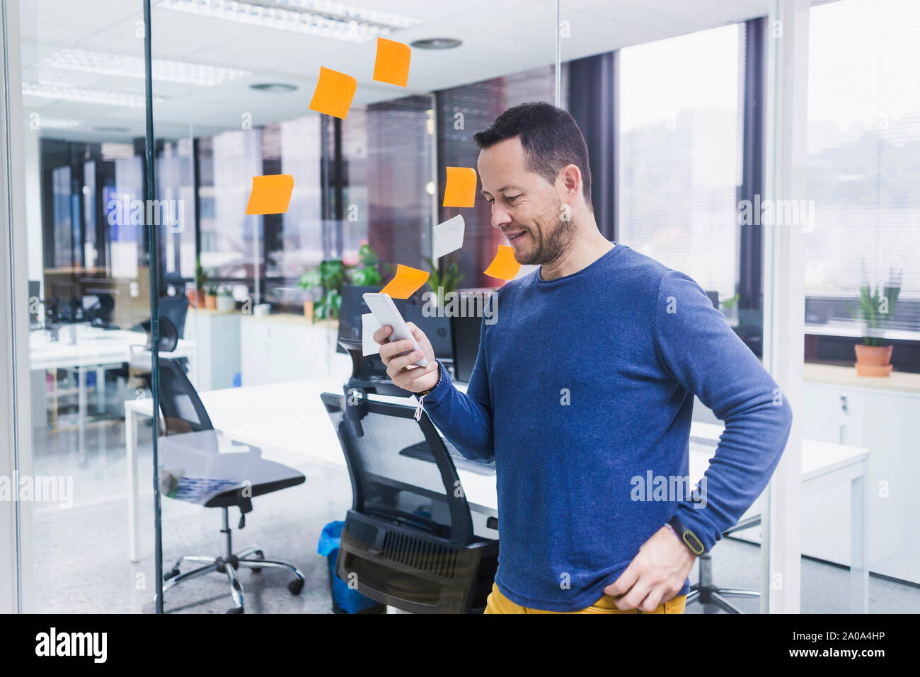 businessman using mobile phone in office Stock Photo
