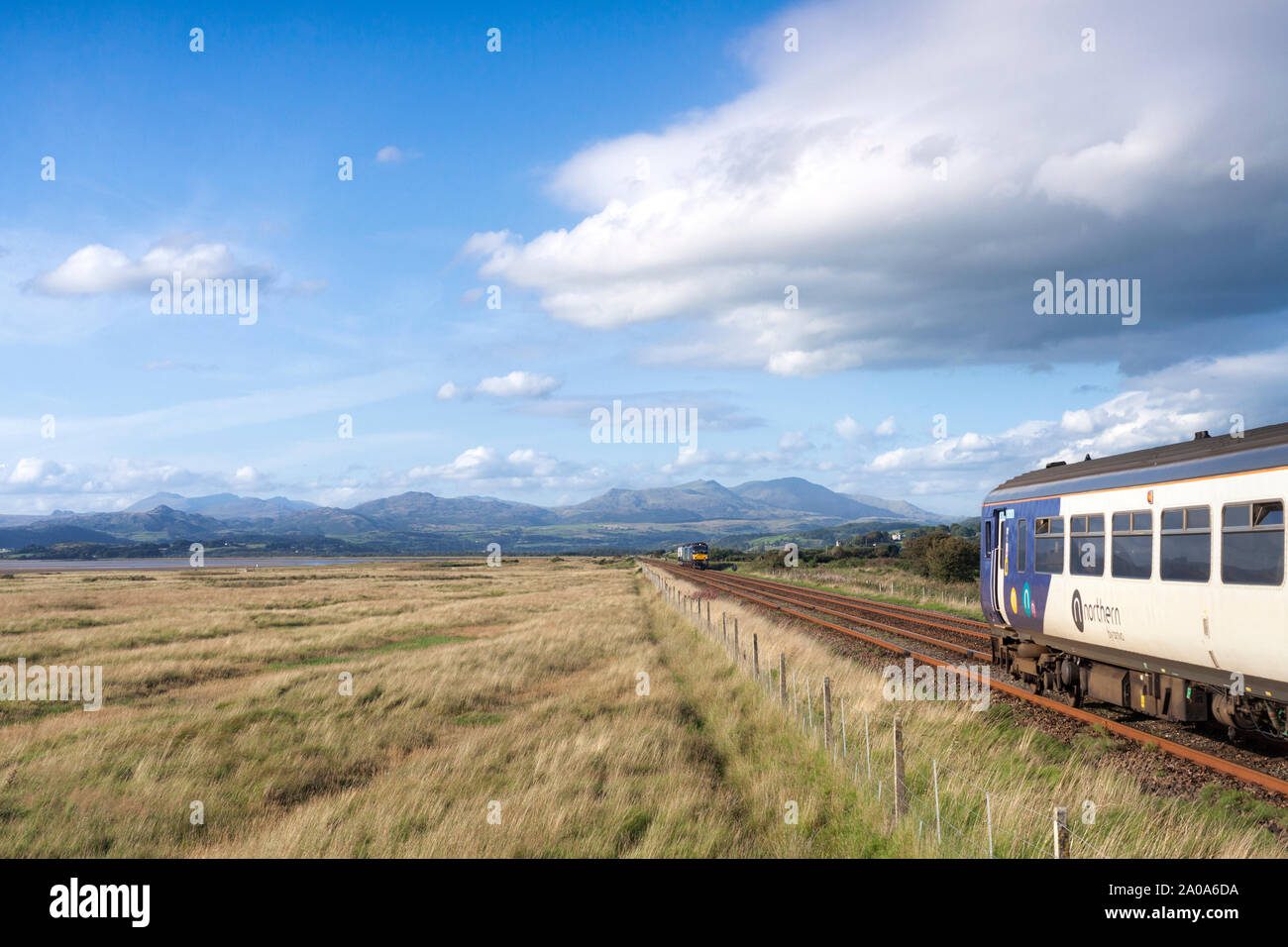 2 Direct rail services class 88 locomotives at Dunnerhome on the Cumbrian coast line with a nuclear flask train passing a Northern rail class 156 Stock Photo