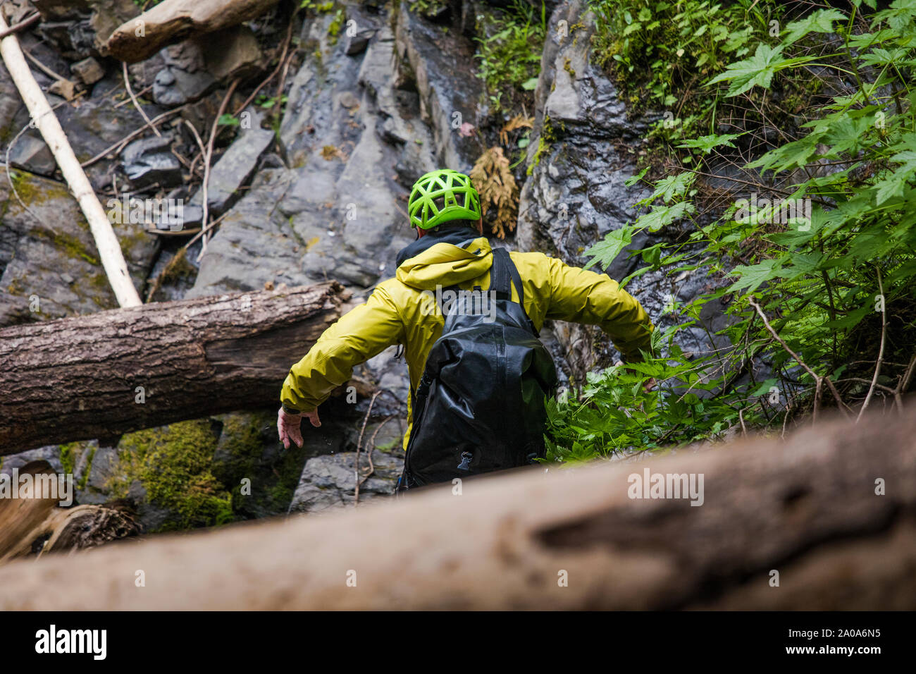 Hiker jumps moves quickly through a canyon full of obstacles. Stock Photo
