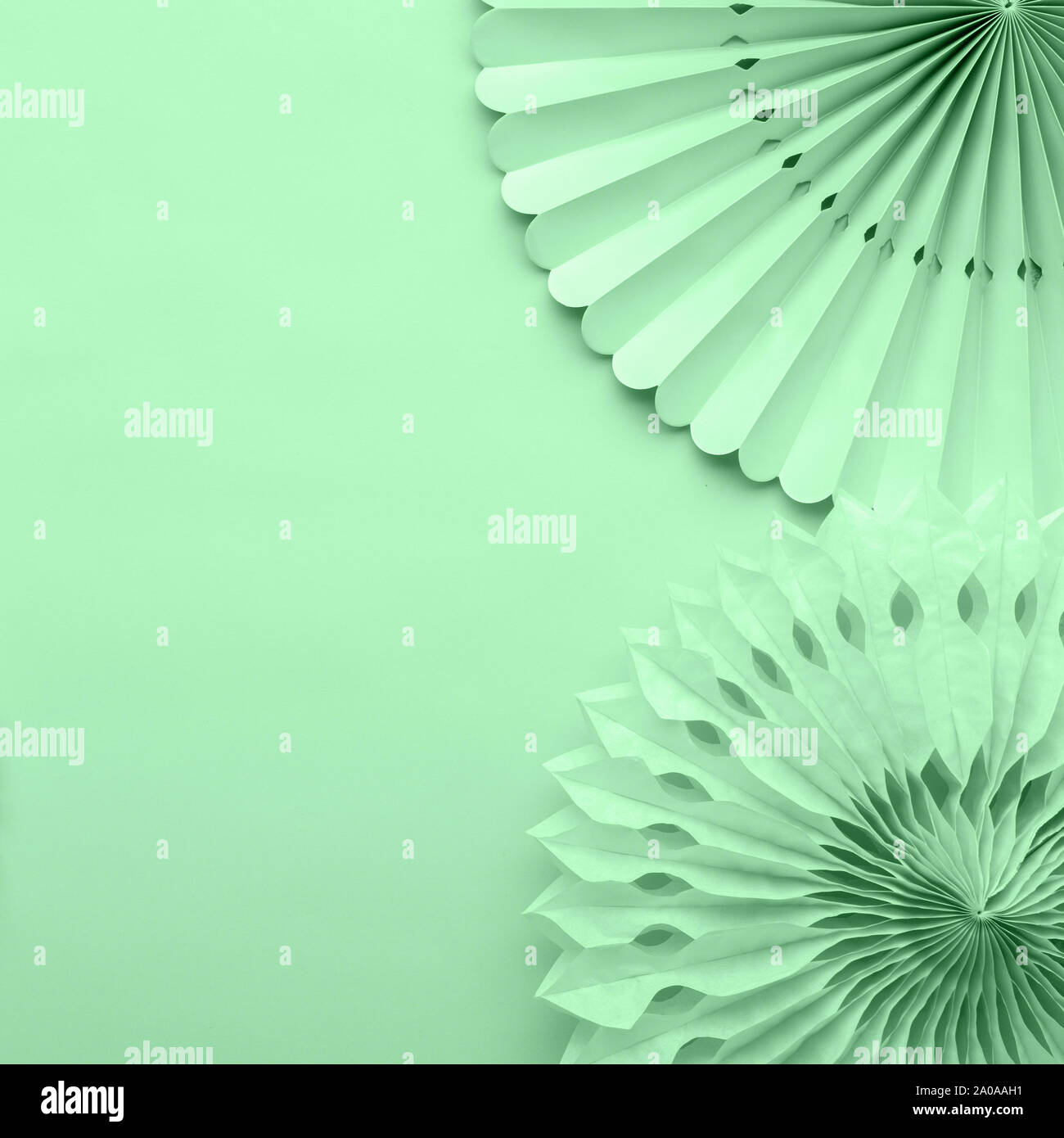 Chinese paper fans in pastel colors on trendy green, top view, copy ...