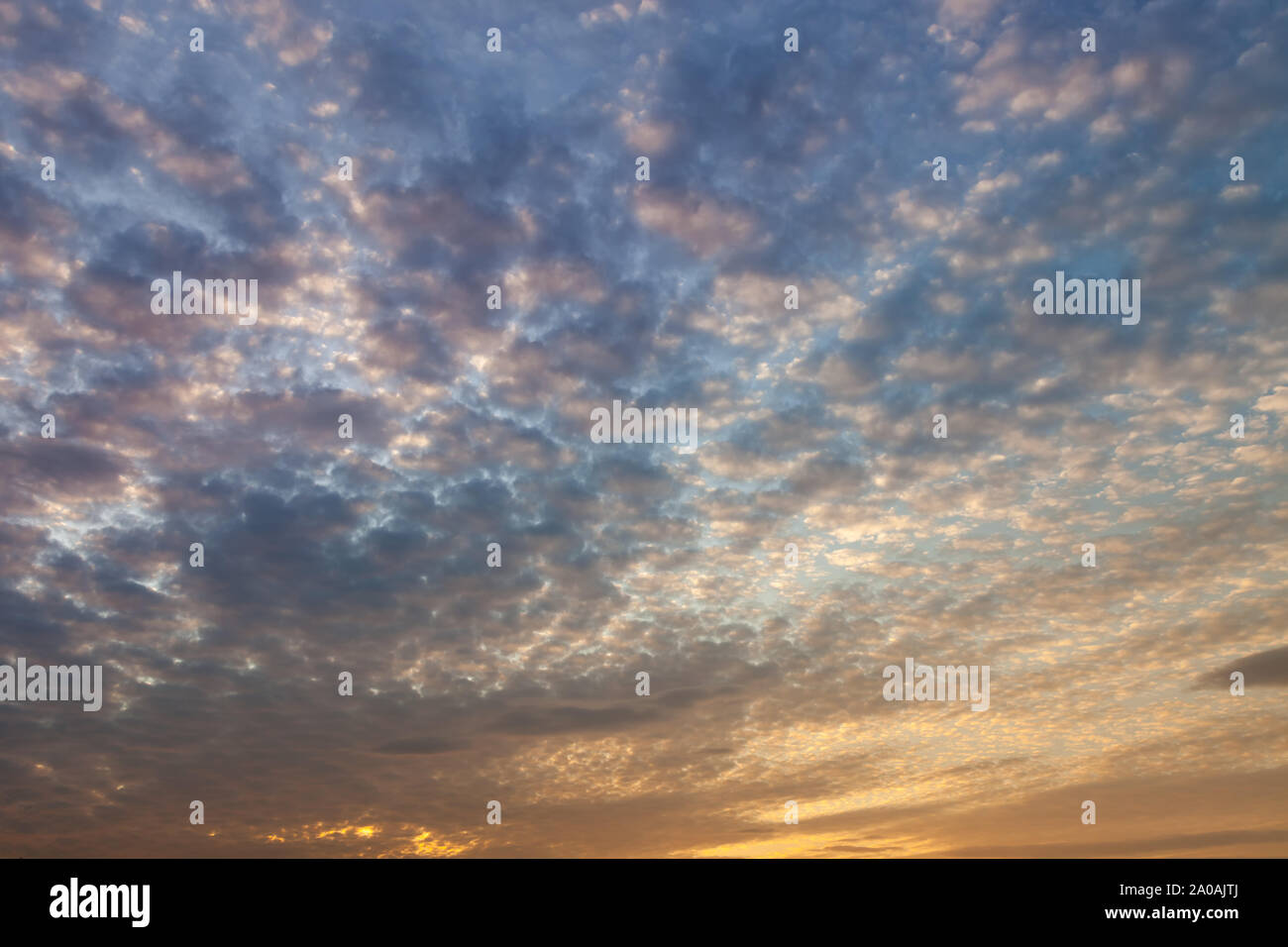 Beautiful colors of dramatic sunset sky and clouds with dramatic golden ...