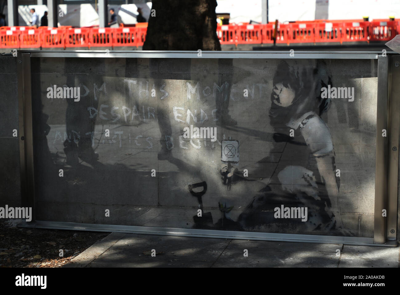 A protective case is placed around the Banksy mural, which appeared following Extinction Rebellion climate change protests, on Marble Arch, London, to preserve it for the future. Stock Photo
