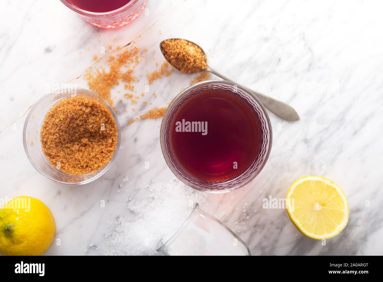 Homemade Isotonic Energy Drink and Ingredients. Glass With Red Liquid