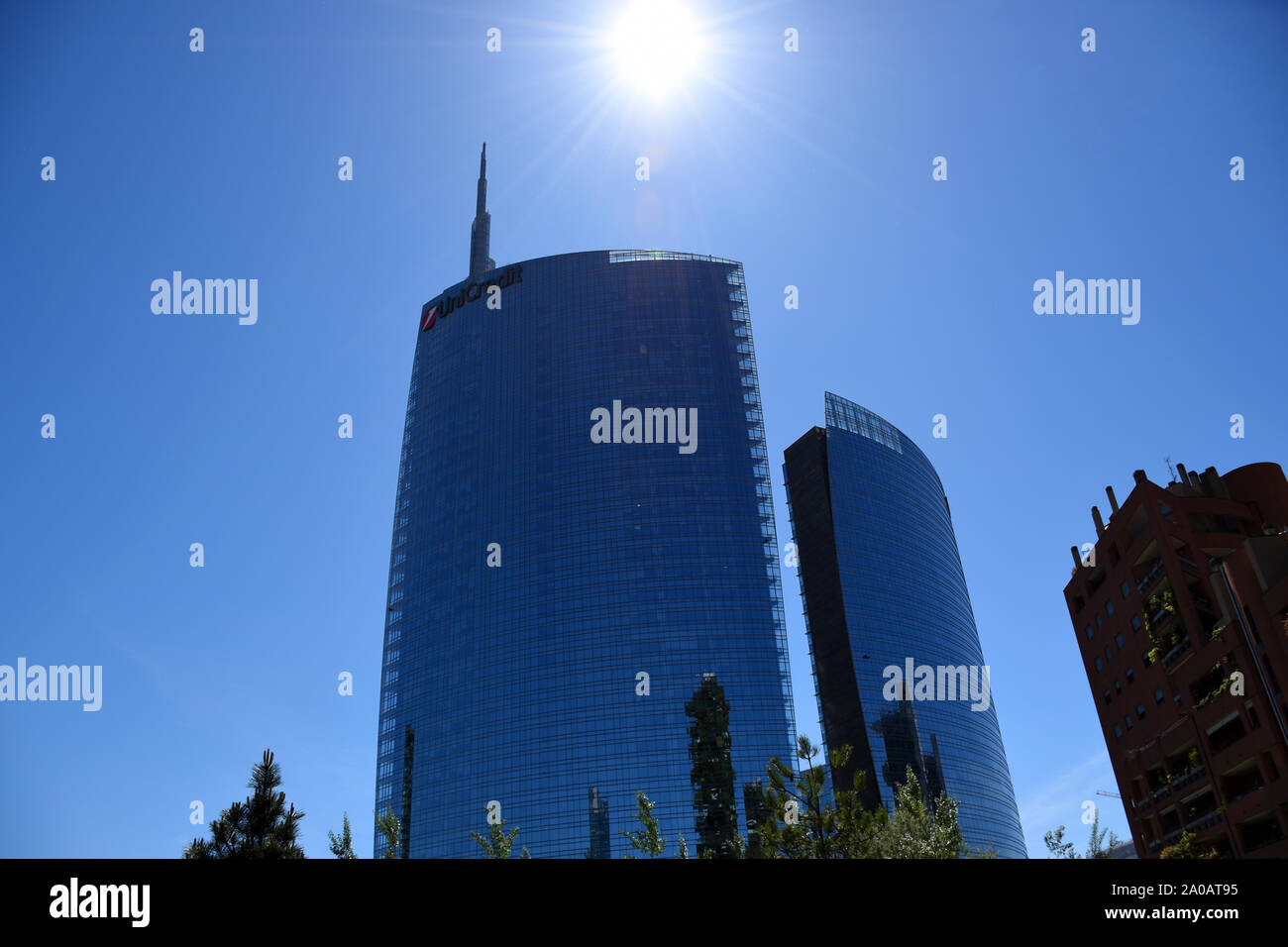 View of the stunning, amazing, full glass UniCredit Tower skyscraper from Gae Aulenti Park, it’s the tallest building (231 meters) in Italy designed b Stock Photo