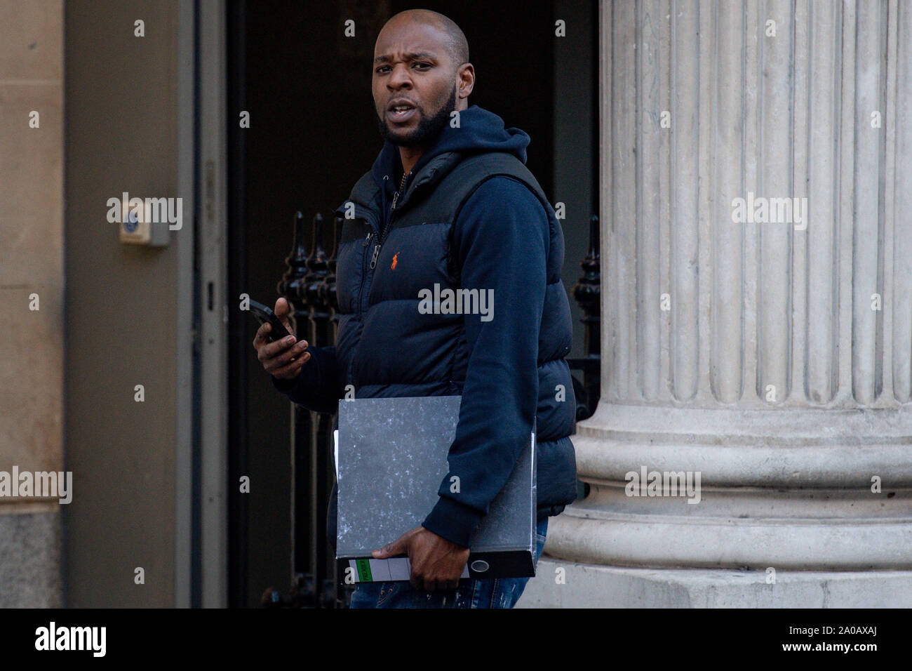 Ras Robinson leaves Bristol Crown Court. Robinson is a defendant in a trial concerning the alleged blackmail of a professional footballer, who cannot be named for legal reasons. Stock Photo