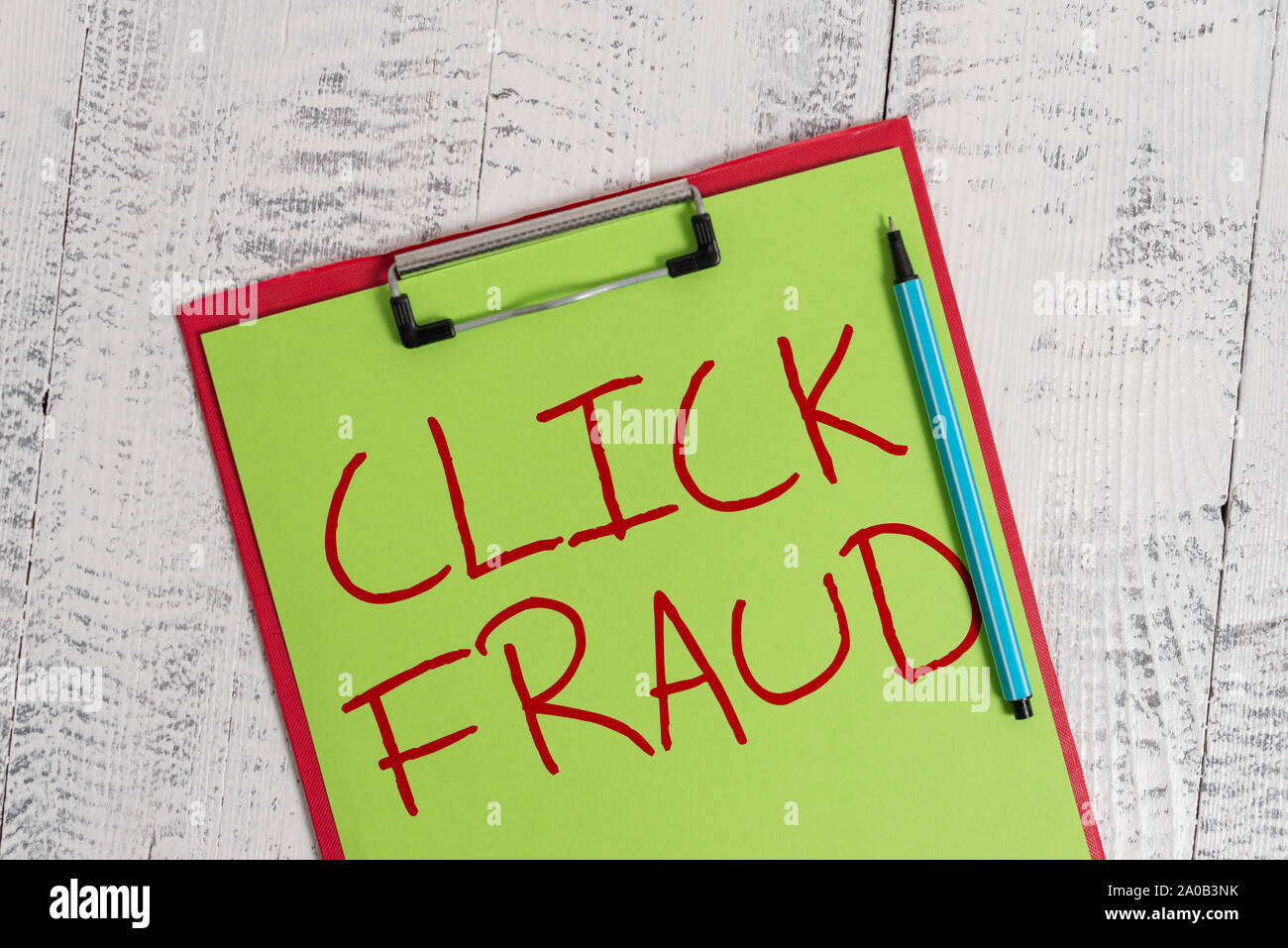 Handwriting text Click Fraud. Conceptual photo practice of repeatedly clicking on advertisement hosted website Colored clipboard blank paper sheet mar Stock Photo