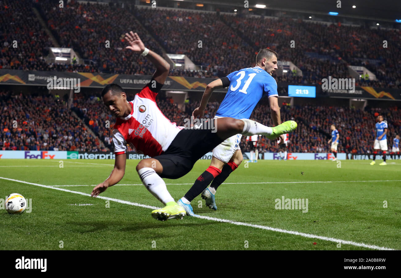 Feyenoord's Renato Tapia (left) and Rangers' Borna Barisic battle for the ball during the UEFA Europa League Group G match at Ibrox Stadium, Glasgow. Stock Photo