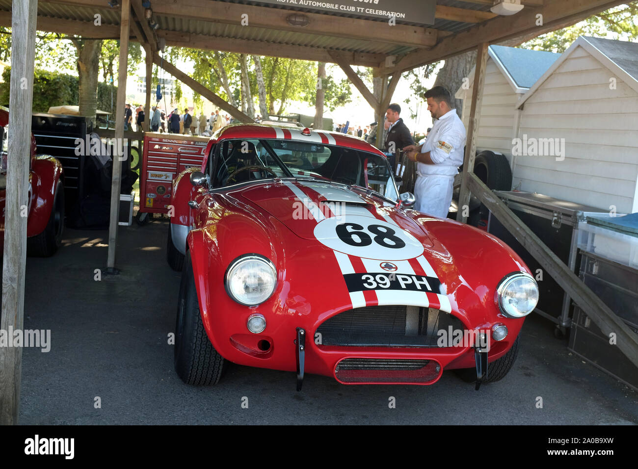 Imminent . Lab September 2019 - Red AC Cobra race cars in the paddock at Goodwood Revival  Stock Photo - Alamy