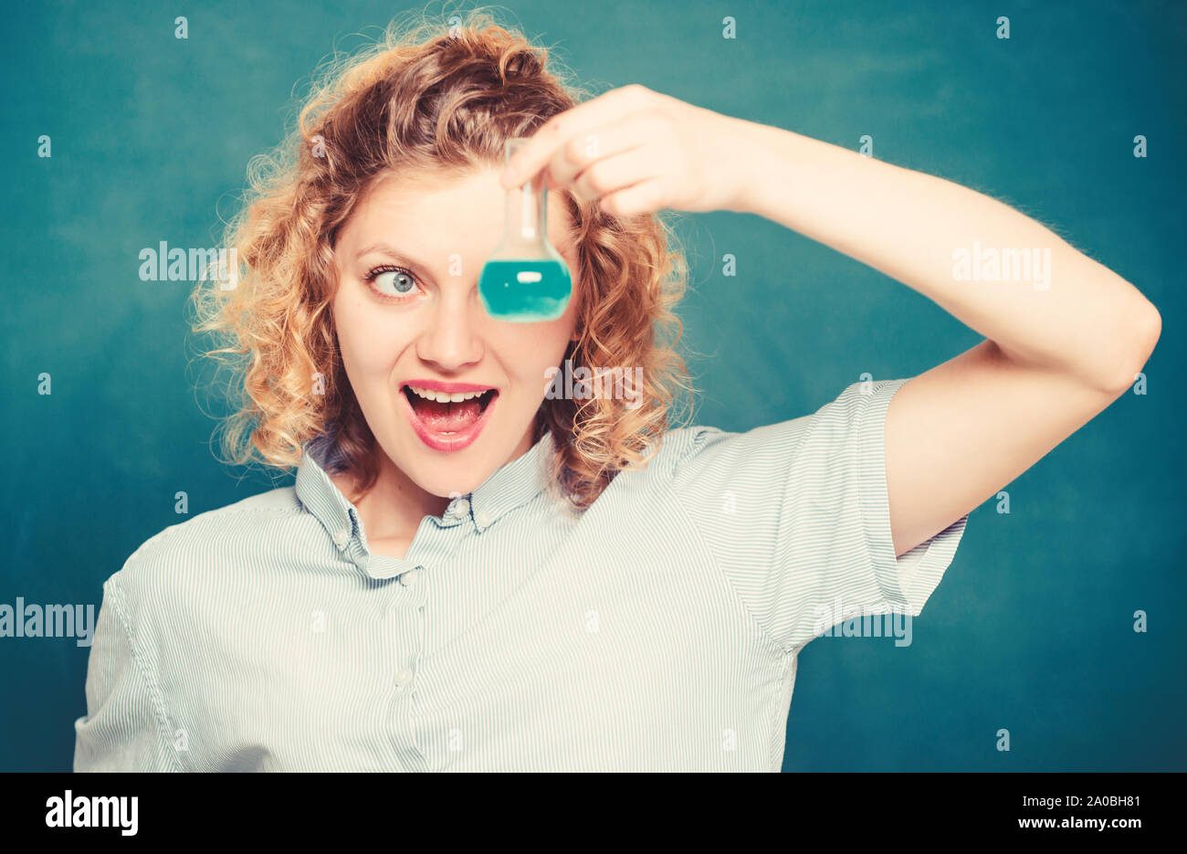 Science and education. girl hold chemical flask with liquid. happy student with beaker. biology experiment. sample formula. chemistry research results. scientist at school lab. school lesson. Stock Photo